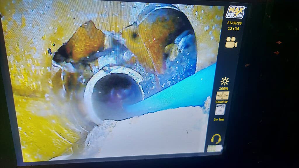 CCTV drain survey camera inspecting underground pipe for subsidence causes.