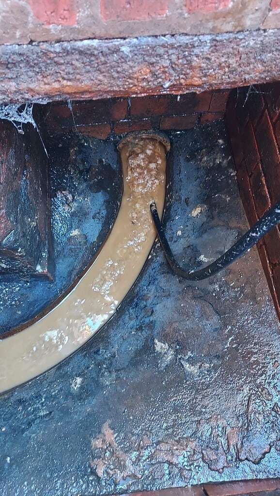 Clearing a blocked drain with a drain jetting tool at a local gym in Loughborough.