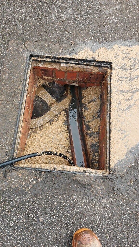 Image of a blocked drain being cleared at a school in Nottingham.