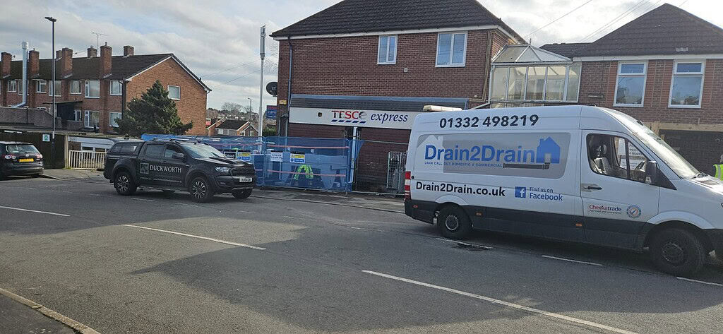 Drain 2 Drain Ltd van repairing Tesco Express drainage in Derby.