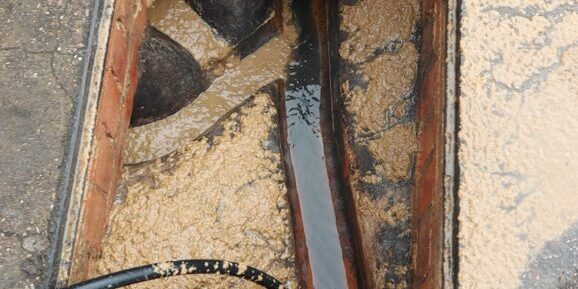 Image of a blocked drain being cleared at a school in Nottingham.