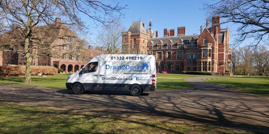 Drain 2 Drain Ltd van providing professional drainage solutions at a historic estate.