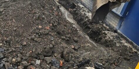 Drainage investigation work near a commercial building in Derby.